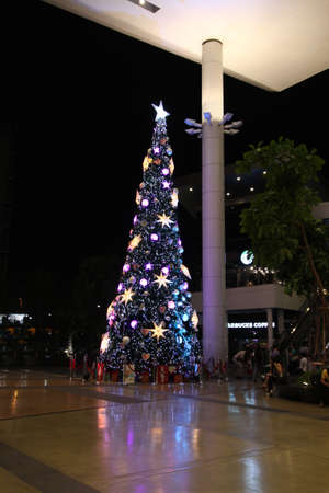 Mega Bangna Bangkok, Thailand, November 18, 2014-Christmas tree with Decorated ornament red star, patchwork hearts, hat and small presents new year 2015のeditorial素材