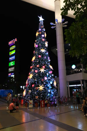 Mega Bangna Bangkok, Thailand, November 18, 2014-Christmas tree with Decorated ornament red star, patchwork hearts, hat and small presents new year 2015のeditorial素材