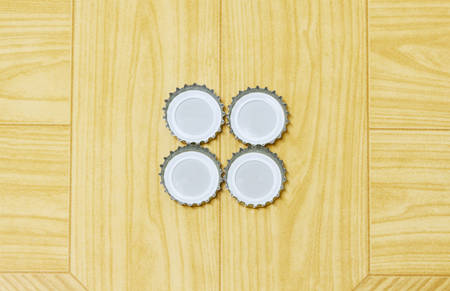 Bottle Cap,Metal Beer Bottle Tops On brown background,の写真素材