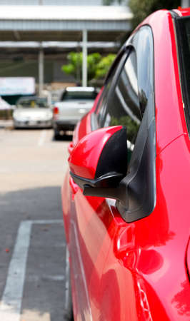 car parking with side rear-view mirror closed for safetyの写真素材