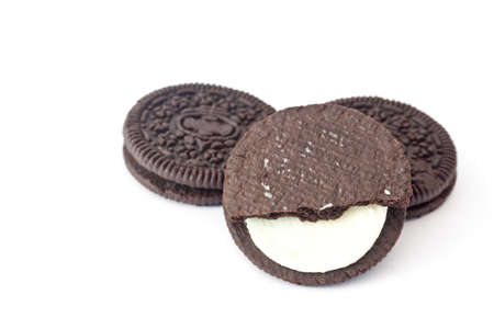 Chocolate cookies with cream filling isolated on white background.の写真素材