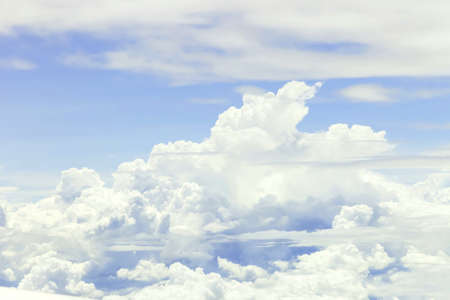 Clouds and sky as seen through window of an aircraft