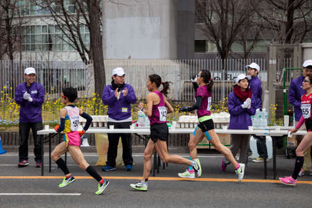 NAGOYA, JAPAN - MARCH 13, 2016: Nagoya Women's Marathon 2016. 
Women's running in the downtown. 
Course Start and finish at Nagoya Dome Distance 42.195km. Nagoya city Japan.のeditorial素材