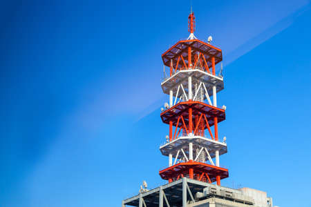 Communications tower with a beautiful blue skyの写真素材
