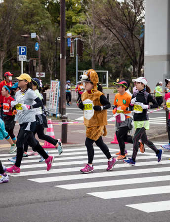 NAGOYA, JAPAN - MARCH 13, 2016: Nagoya Women's Marathon 2016. 
Women's running in the downtown. 
Course Start and finish at Nagoya Dome Distance 42.195km. Nagoya city Japan.のeditorial素材
