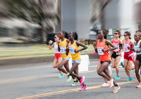 NAGOYA, JAPAN - MARCH 13, 2016: Nagoya Women's Marathon 2016. Women's running in the downtown. Course Start and finish at Nagoya Dome Distance 42.195km. Nagoya city Japan.のeditorial素材