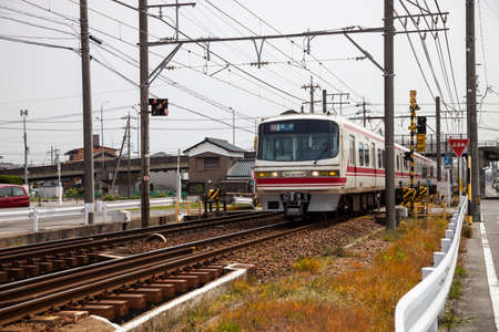 NAGOYA, JAPAN - April 16, 2016: Meitetsu Limited Express travels on Toyohashi Line in Japan. Meitetsu Panorama Express train direct from Nagoya Meitetsu Station, with connections on to Toyohashi (via Jingu Mae Station), Inuyama and Gifu.のeditorial素材
