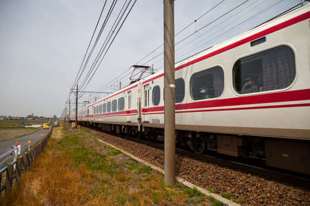 NAGOYA, JAPAN - April 16, 2016: Meitetsu Limited Express travels on Toyohashi Line in Japan. Meitetsu Panorama Express train direct from Nagoya Meitetsu Station, with connections on to Toyohashi (via Jingu Mae Station), Inuyama and Gifu.のeditorial素材