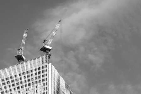 Silhouette of High crane at construction site.の写真素材