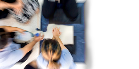 Education healthcare first aid of Cardiopulmonary resuscitation (CPR) training medical procedure, demonstrating chest compression on CPR doll ,emergency training for safe life,copy space ,Zoom effect.の写真素材