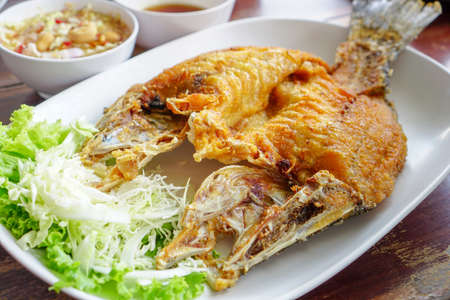 Thai Food,Deep Fried Snapper topped with Sweet Fish Sauce.の写真素材