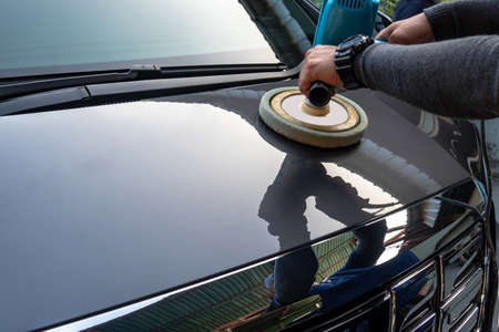 Car care with power buffer machine at service station ,Polishing the car. with power buffer machineの写真素材