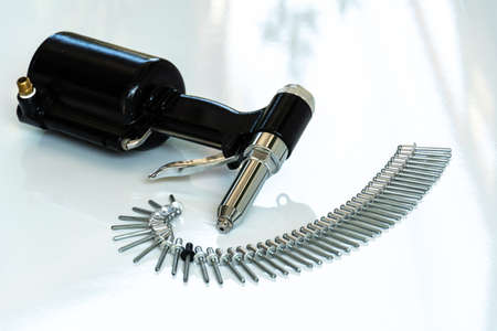 Pop Rivet Gun for Metal ,new rivet and rivet gun on white background.の写真素材