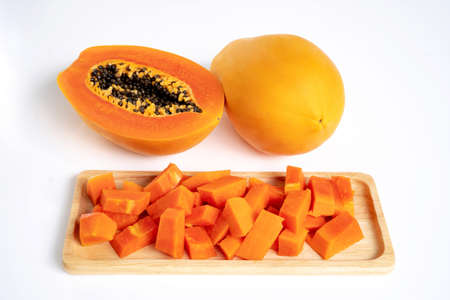 sliced of ripe papaya with seeds isolated on white backgroundの写真素材