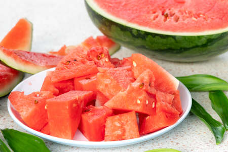 closeup of some pieces of refreshing watermelon on a tableの写真素材