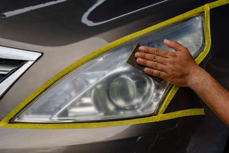 Closeup car lamp or front headlight polishing, renewed headlampの写真素材