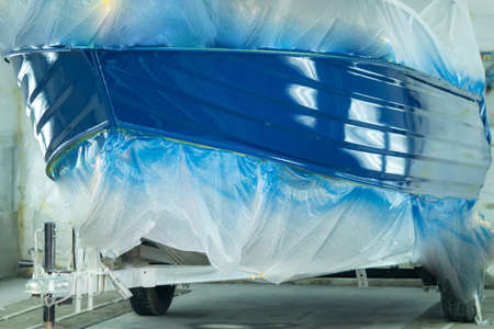 Boat at a service center for painting and repairの写真素材