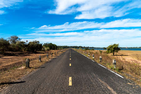 Long road on dam and Blue sky and clouds beautifulの写真素材
