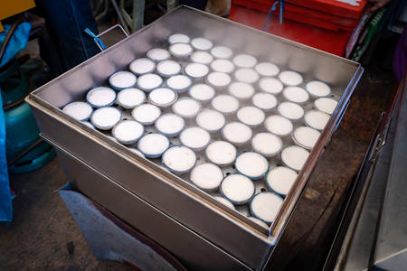 Thai coconut milk custard in white ceramic cups