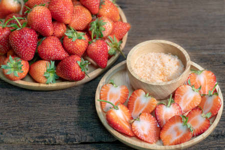 Fresh strawberries on old wooden background