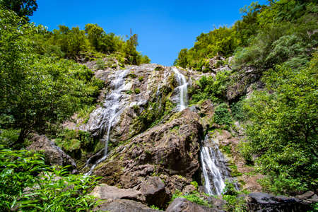 Waterfall in tropical forest at Khlong Lan National park, Kamphaeng Phet, Thailand.の写真素材
