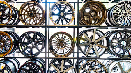 the shop shelves with metal disks for automobile wheels の写真素材