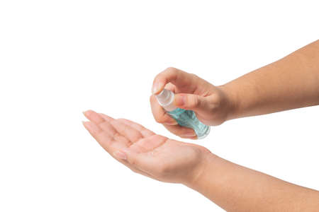 Asian girl , Cleaning hands by liquid alcohol, to prevent germs on a white background ,Washing hand with Alcohol Sanitizer ,clipping pathの写真素材