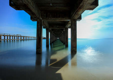 The old bridge in to the seaの写真素材