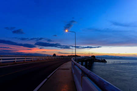 The bridge cross the river and before sunriseの写真素材
