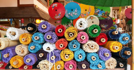 Thai style handmade colorful umbrellas background. The handmade ancient umbrella of Chiang Mai, the north of Thailand, Lanna umbrella.のeditorial素材