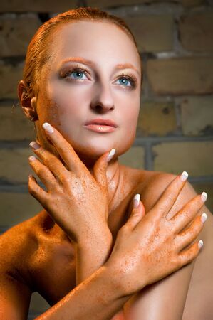 Close up portrait of a beautiful young woman with a creative make upの写真素材
