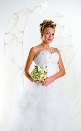 Beautiful bride with bouquet of flowersの写真素材