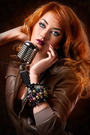 Beautiful redhead singerの写真素材