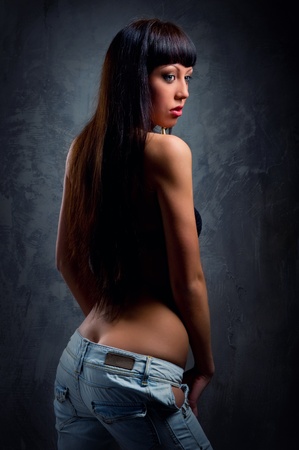 Young sensual woman in jeansの写真素材
