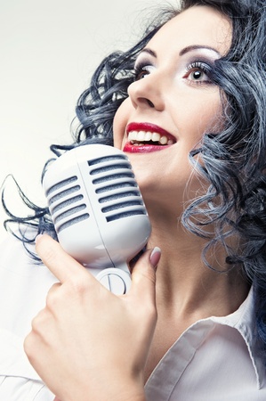 Beautiful young woman singingの写真素材