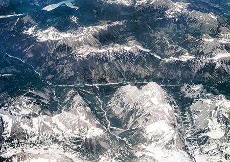 Alps, aerial view from window of airplane の写真素材