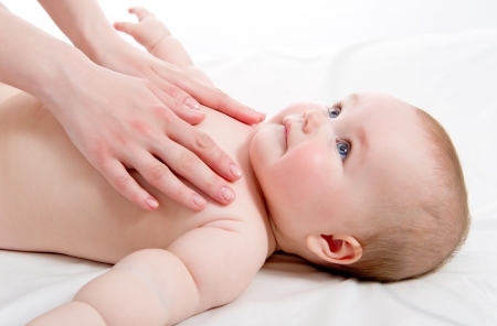 Mother massaging her lovely babyの写真素材