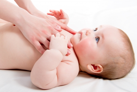 Mother massaging her lovely babyの写真素材