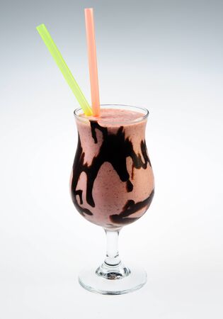 Cocktail with black chocolate over white backgroundの写真素材