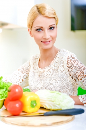 Young woman in the kitchen.Healthy Food. Dieting Concept. Healthy Lifestyle. Cooking At Home.の写真素材