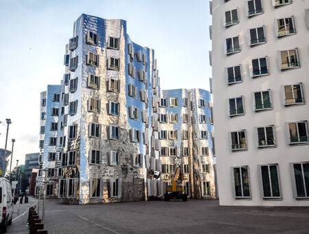 Dusseldorf, Germany - September 14, 2014: Exterior of futuristic building Neuer Zollhof at Dusseldorf Media Harbor.This building complex was designed by Frank O. Gehry and completed in 1998.のeditorial素材