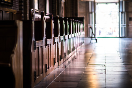 Wooden pews in a row in a churchのeditorial素材