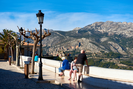 Guadalest, Spain - February 02, 2016: Tourists enjoying valley view in the old town of Guadalest. Guadalest is a small village on the Costa Blanca. Guadalest has been declared a "Monument of Historical and Artistic Value" and is a major tourist attractionのeditorial素材