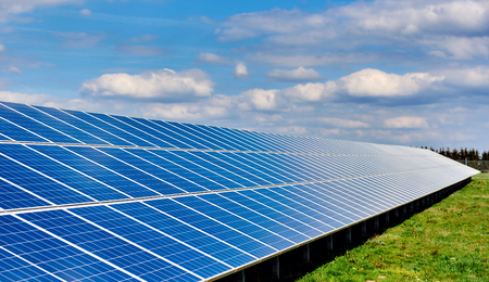 Solar panels on a green field