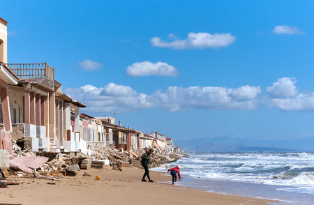 Guardamar del Segura, Spain - April 21, 2017: Damaged beach houses. The wind and waves is washed away the beach houses on the Babilonia beach. Guardamar del Segura. Province of Alicante. Spainのeditorial素材