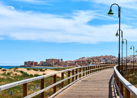 Wooden boardwalk along the beach of La Mata. Costa Blanca, Province of Alicante. Spainの写真素材