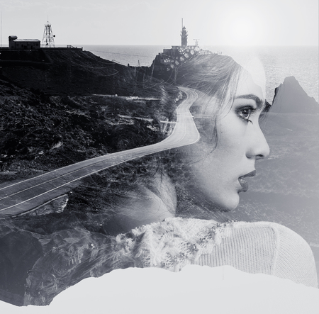 Double exposure. Portrait of woman combined with a mountain road and the sea. Black and white photo