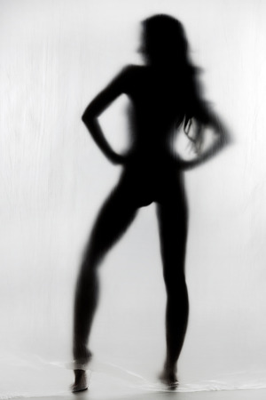 Silhouette of a naked womanの写真素材