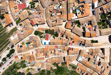 Directly from above view ancient houses rooftops and roads, view from top. Montesa village. Spainの写真素材