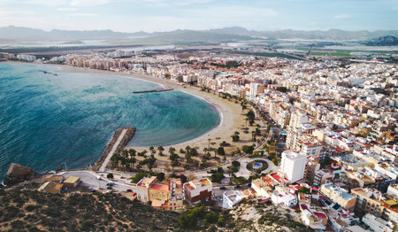 Aerial view to Aguilas coastline, townscape, sandy beach and Mediterranean Sea waters view from above. province of Murcia. Spainの写真素材